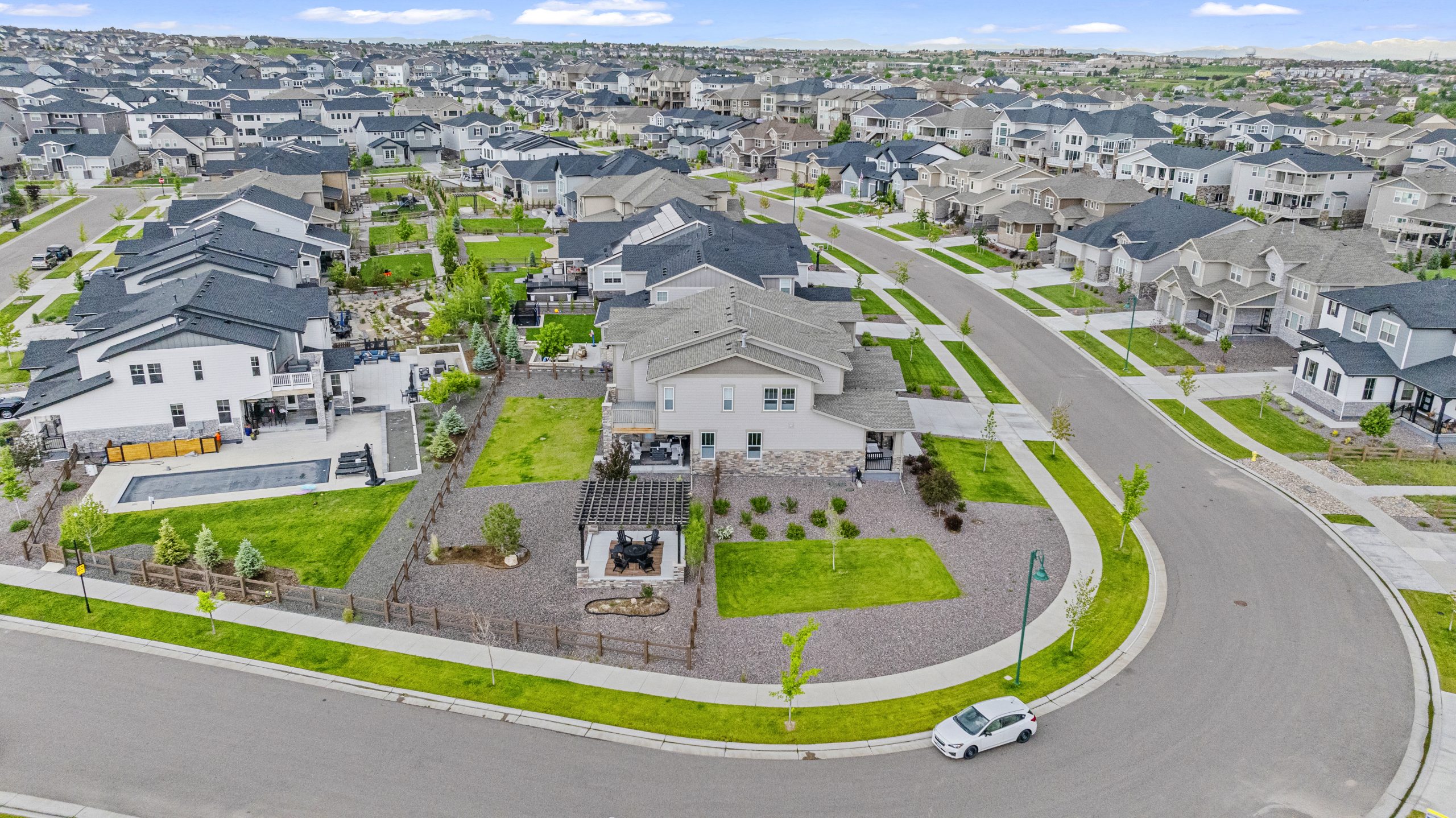 Wide drone panorama of the surrounding neighborhood and park