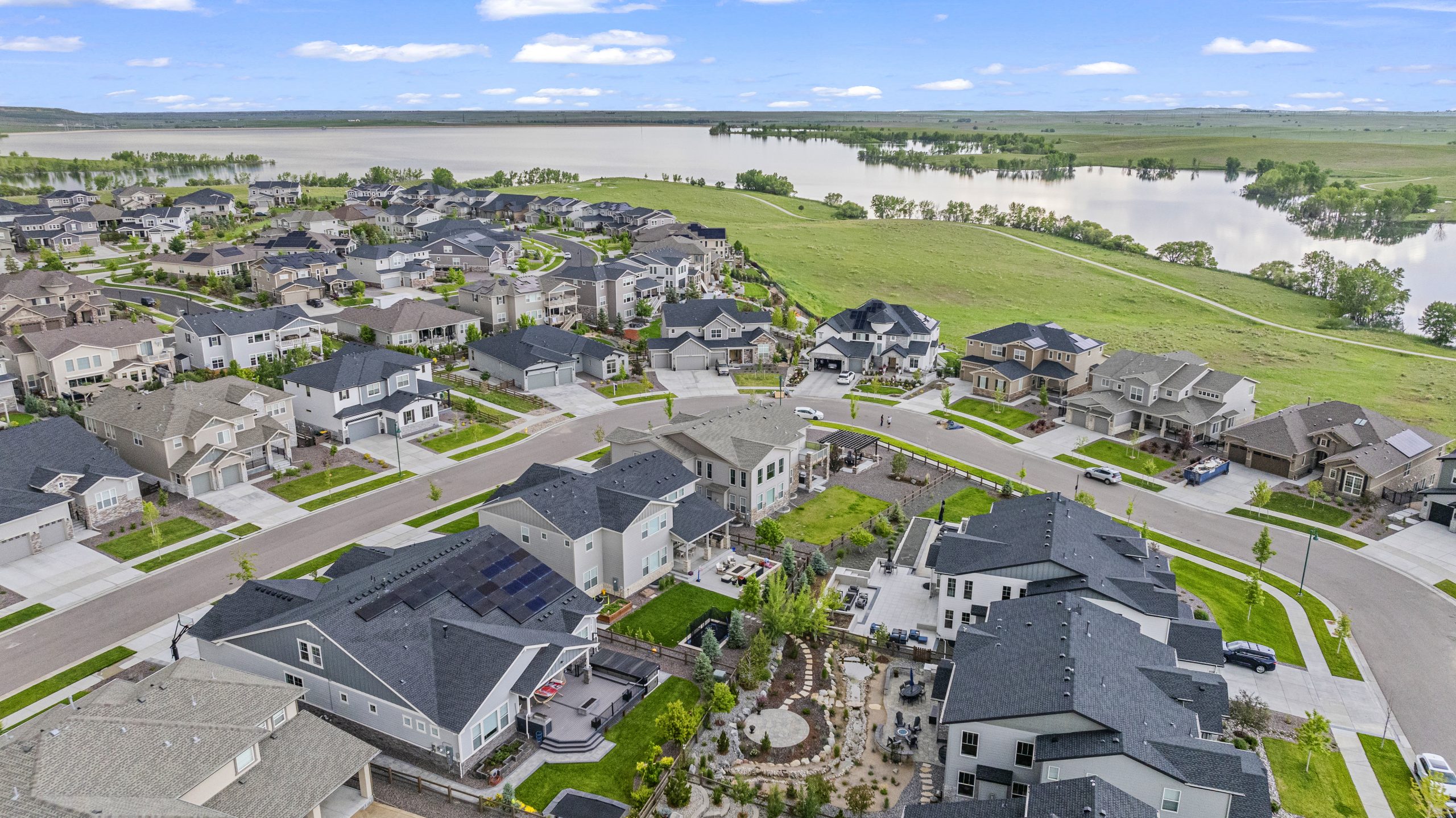 Sweeping aerial panorama capturing property and skyline